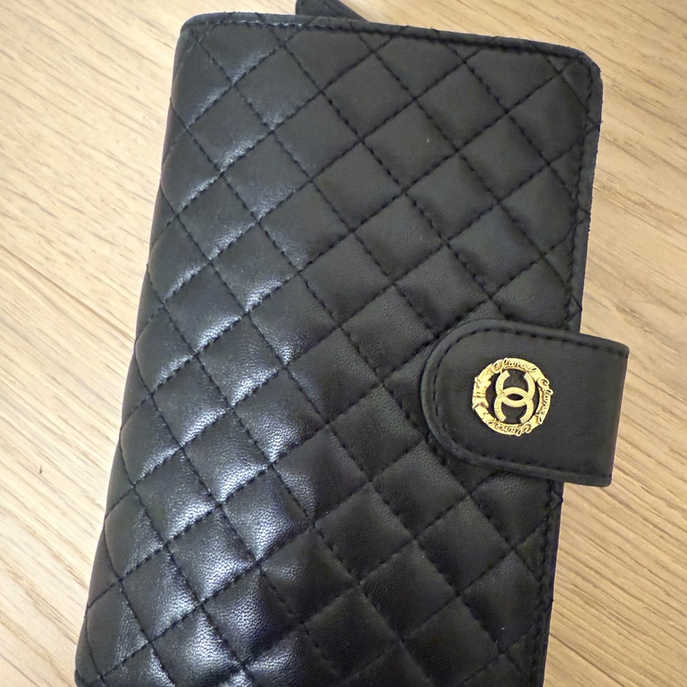 CHANEL Black Quilted Leather Wallet with Gold Accent